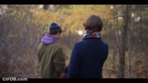 Man And Woman Walking Through Forest Holding Hands GIF
