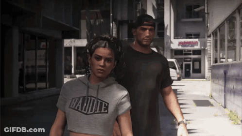 Man And Woman Walking, Woman In Barbie Shirt GIF