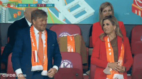 Man And Woman Watching Soccer In Stadium GIF