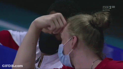 Man And Woman Wearing Face Masks Watching TVP 2 HD GIF