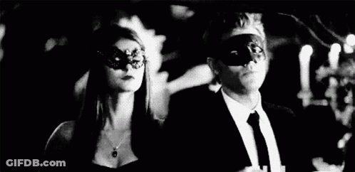 Man And Woman Wearing Masks At Party GIF