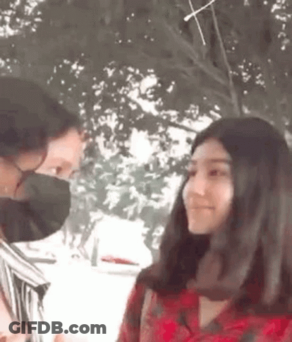 Man And Woman Wearing Masks Talking GIF