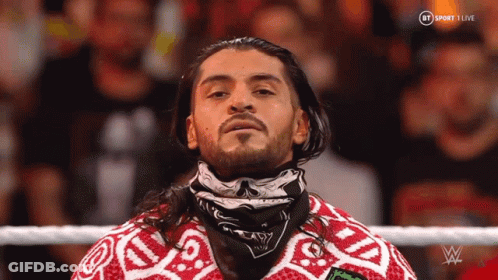 Man And Woman Wearing Masks GIF