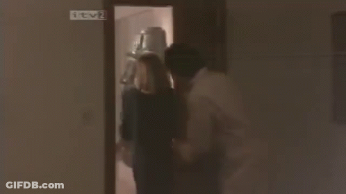 Man And Woman With Blinds Covering Faces GIF