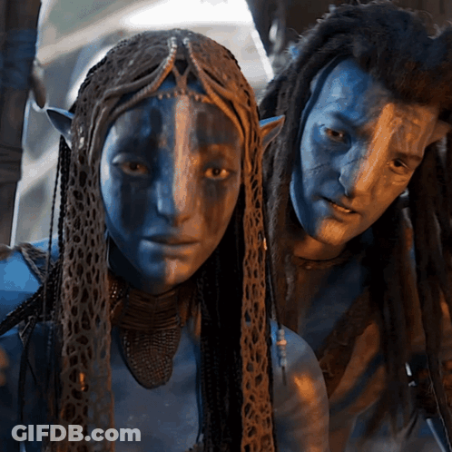 Man And Woman With Blue Faces Posing GIF
