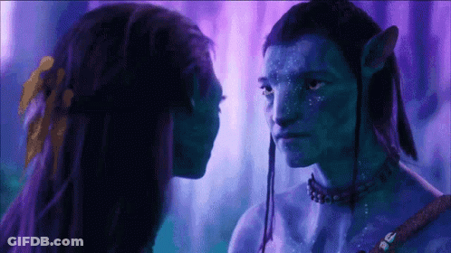 Man And Woman With Blue Painted Faces Looking At Each Other GIF