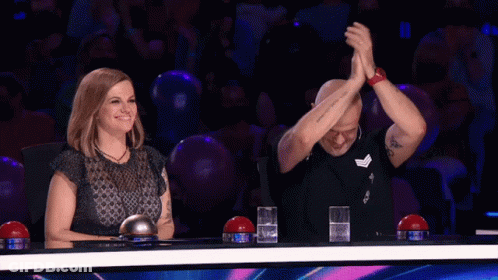 Man And Woman With Hands In Air GIF