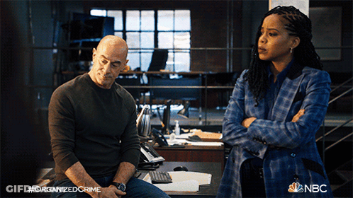 Man And Woman With Hashtag Organized Crime GIF