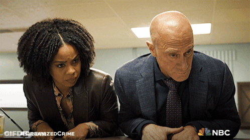 Man And Woman With Hashtag Organized Crime GIF