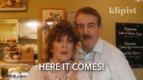 Man And Woman With Homemade Look & Potato Soup Sign GIF