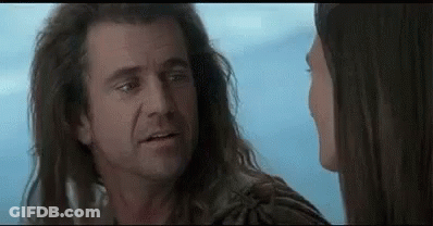 Man And Woman With Long Hair Looking In Movie GIF