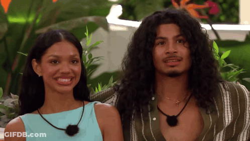 Man And Woman With Long Hair Sitting Together GIF