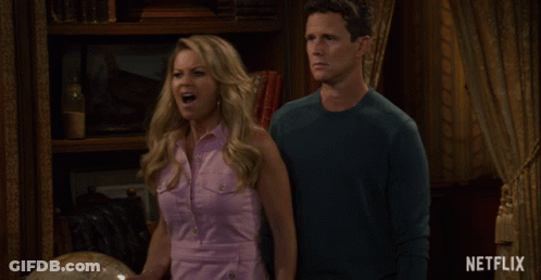 Man And Woman With Netflix Logo GIF