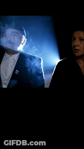 Man And Woman With Smoke Coming Out Of Eyes GIF