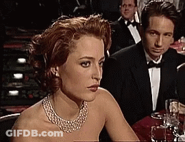 Man And Woman With Wine Glasses At Table GIF