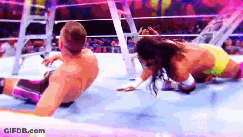 Man And Woman Wrestling In Ring GIF