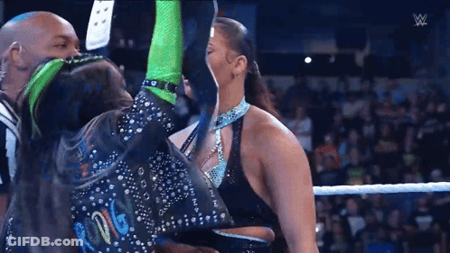 Man And Woman Wrestling, Woman In Green Gloves GIF