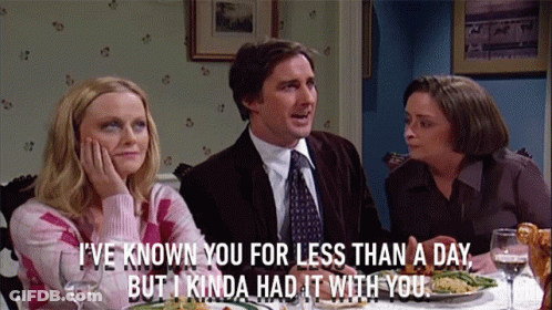 Man And Women Sitting At Table GIF