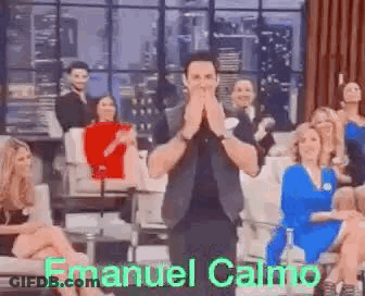 Man Applauding In Front Of Group GIF