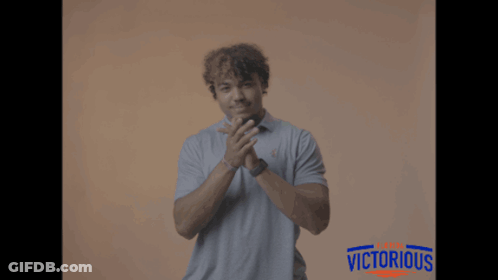 Man Applauding In Front Of Victorious Sign GIF