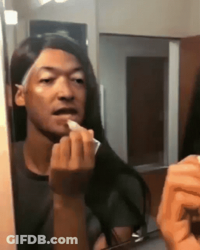 Man Applying Lipstick In Mirror GIF
