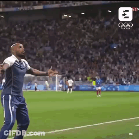 Man Arms Outstretched In Front Of Crowd On Soccer Field GIF