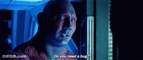 Man Asking Another If He Needs A Hug GIF