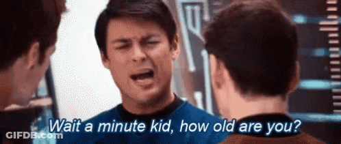 Man Asking Two Others To Wait A Minute GIF