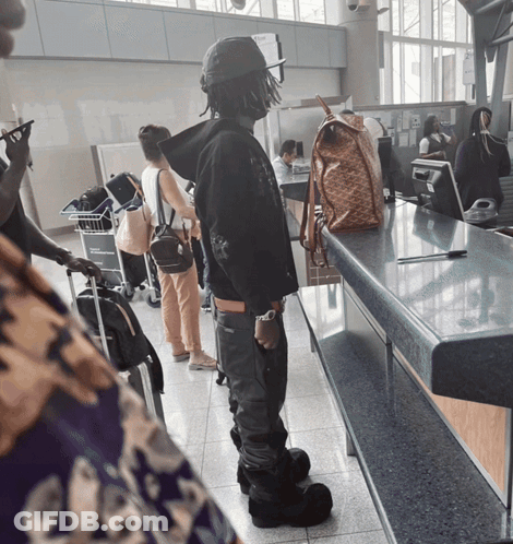 Man At Arrivals Counter GIF