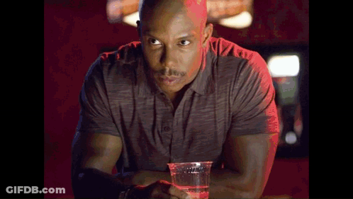Man At Bar Holding Plastic Cup Of Water GIF