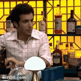 Man At Bar With Agada Bottle GIF