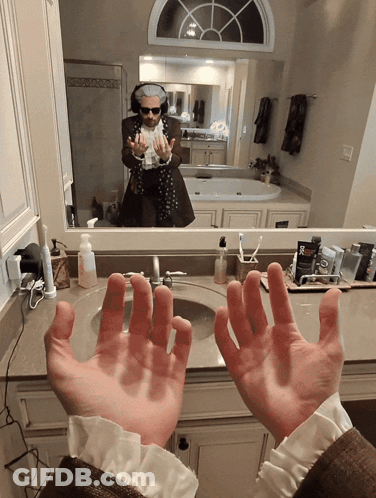 Man At Bathroom Sink With Hands Up GIF