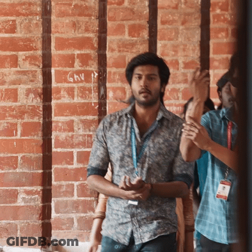 Man At Brick Wall With GMV GIF
