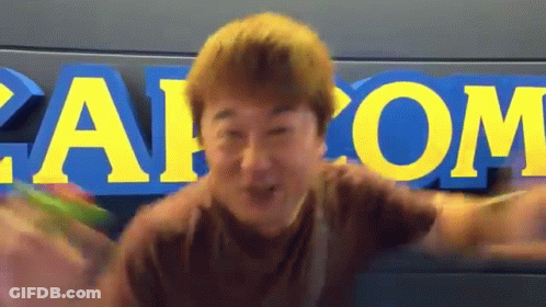 Man At Capcom Sign GIF