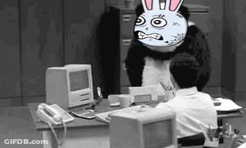 Man At Computer With Cartoon Bunny On Head GIF