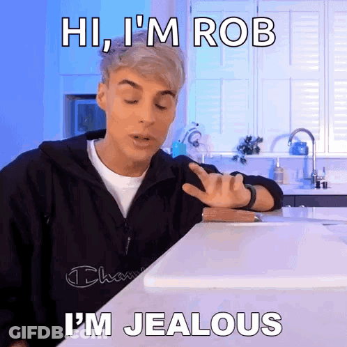 Man At Counter Saying Hi I'm Rob I'm Jealous GIF