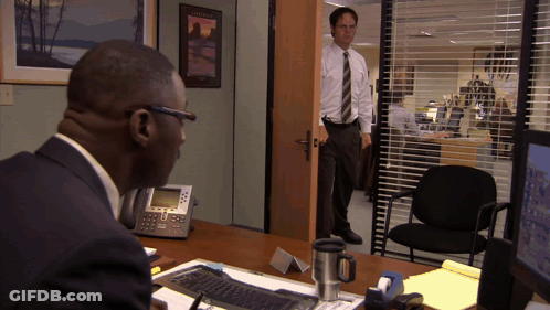 Man At Desk In Front Of Hawaii Sign GIF