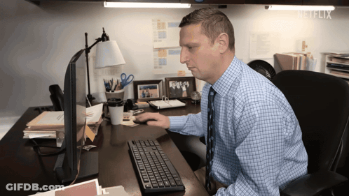 Man At Desk In Front Of Netflix Computer GIF
