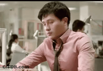 Man At Desk In Pink Shirt And Tie GIF