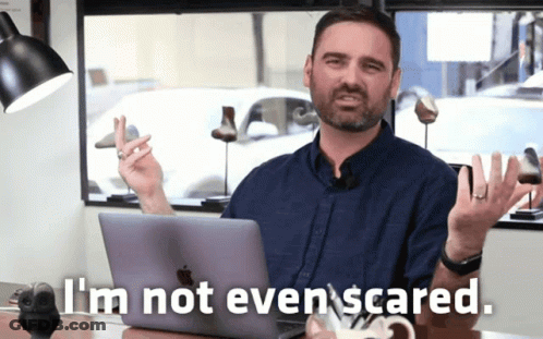 Man At Desk Saying I'm Not Even Scared GIF