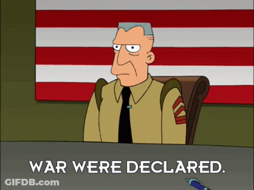 Man At Desk Saying War Were Declared GIF