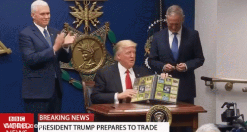 Man At Desk With BBC World News Headline GIF