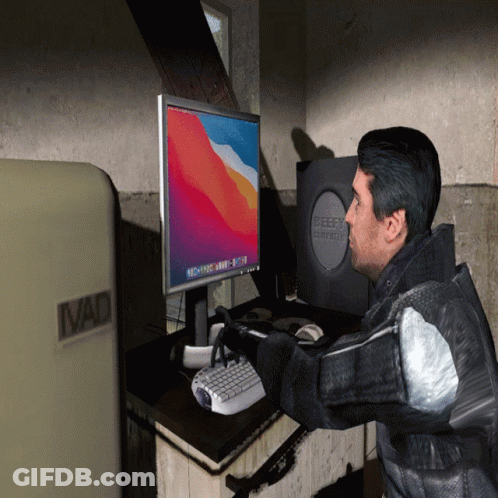 Man At Desk With Beefy Computer GIF