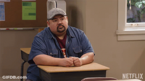 Man At Desk With Netflix Logo GIF