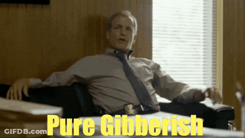 Man At Desk With Pure Gibberish Sign GIF