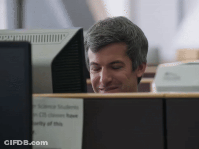 Man At Desk With Science Students Sign GIF