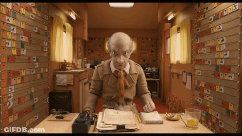 Man At Desk With Sticky Notes Saying A GIF