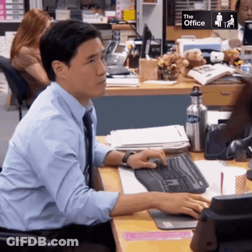 Man At Desk With The Office Sign GIF