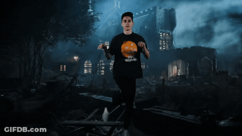 Man At Haunted House With Pumpkin Shirt GIF