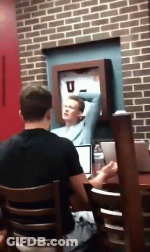 Man At Laptop With Arm Outstretched GIF